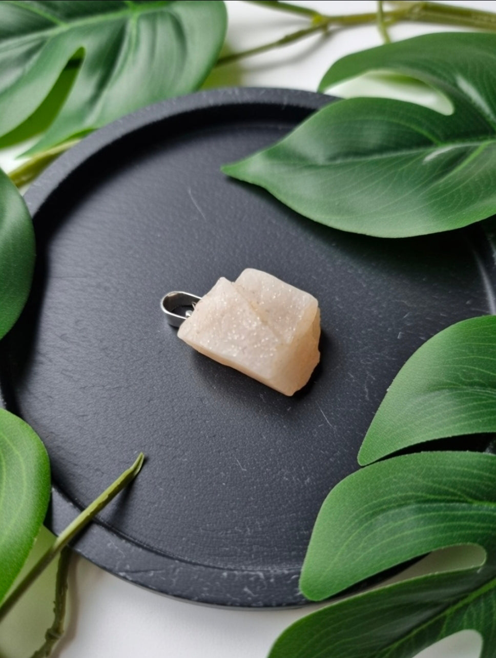 Raw rose quartz pendant