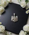 Cat" pendant with amber eyes
