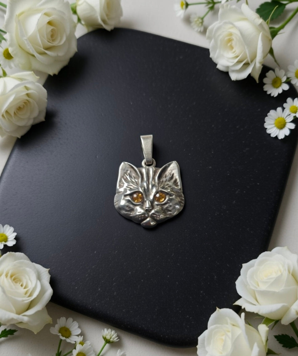 Cat" pendant with amber eyes